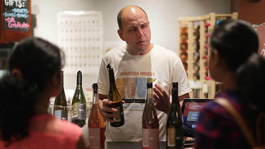 Boston, MA., 10/19/16, At the Massachusetts Wine Shop at Boston Public Market, Marco Montez, owner-winemaker of Travessia Urban Winery offers samples of his wine. Globe staff/Suzanne Krater